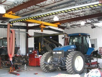 blue tractor in a garage